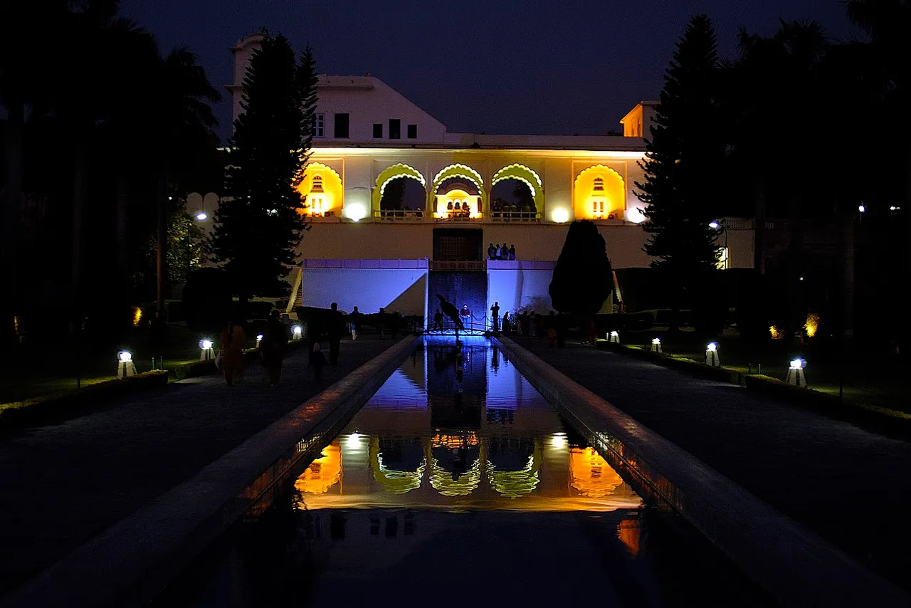 A garden pathway glowing with warm low-voltage lighting at dusk